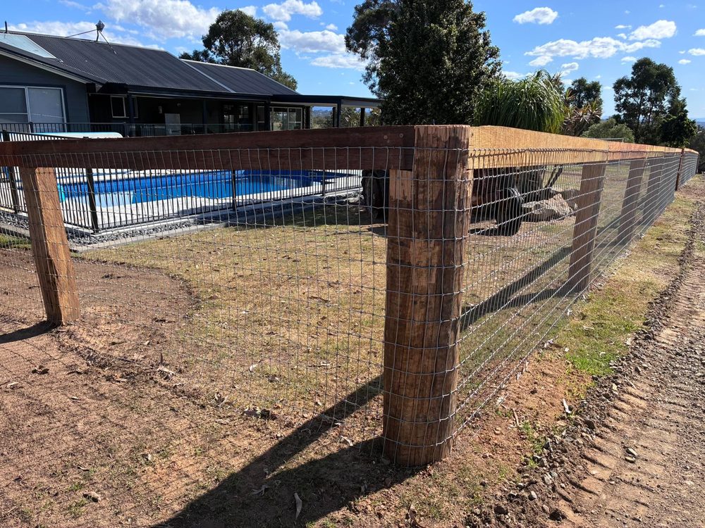 Hardwood corner post with sawn timber top rail and mesh